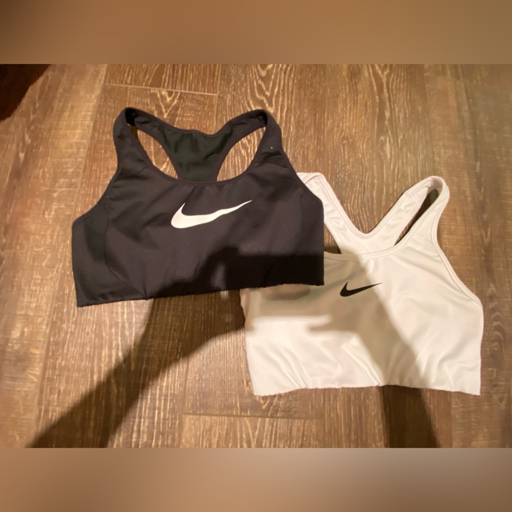 Two Nike sports bras. Size Medium.